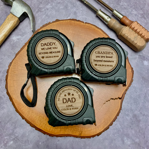 Three tape measures with walnut plywood inserts about being the best dad ever